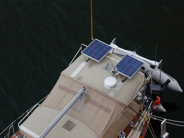 Fixed frame solar panels installed onto the top of a boat.